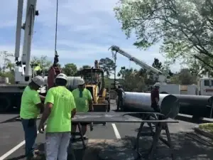 Sign installation crew using crane equipment by General Sign Service Corporation.